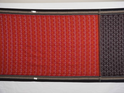 Model draped in a maroon and black Sambalpuri cotton saree showcasing elegant traditional handloom style