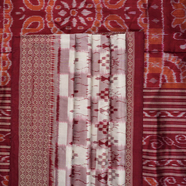 Close-up of the Sambalpuri silk saree fabric, detailing its luxurious texture and fine handloom weave.