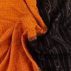 Styling view of a plain yellow and black Sambalpuri cotton saree, highlighting its elegant drape.