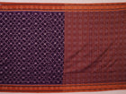 Violet & rust Sambalpuri cotton saree with motifs, elegantly draped.