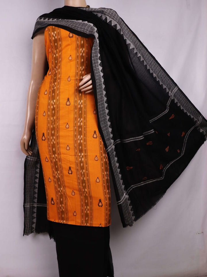 Close-up view of the blouse piece from a yellow and black cotton Sambalpuri dress material featuring motifs.