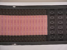 Model wearing a black Sambalpuri cotton saree with multi-color Pasapalli pattern in a full drape.