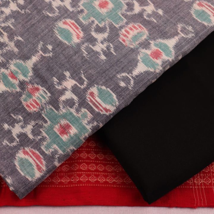 Close-up of blouse piece, showcasing grey cotton with black Sambalpuri motifs