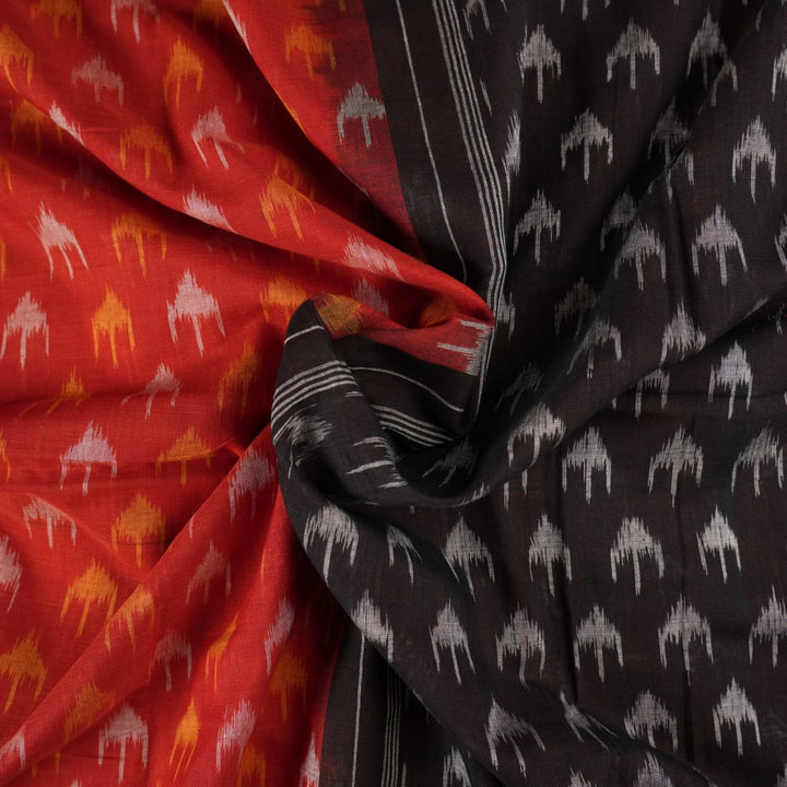 Model wearing a rust and black Sambalpuri cotton saree styled with traditional Odisha handloom motifs.