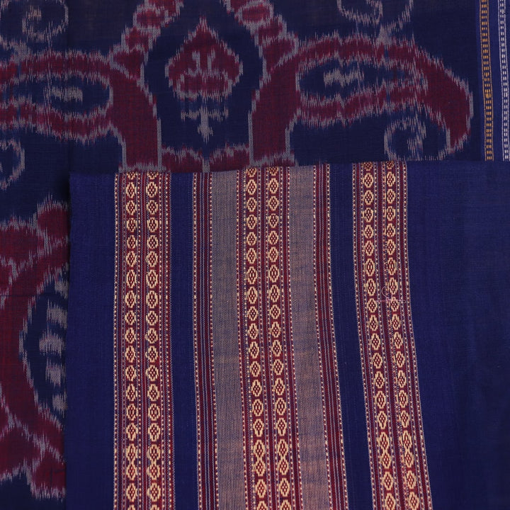 Cream cotton Bomkai saree with blue butta pattern, full view.