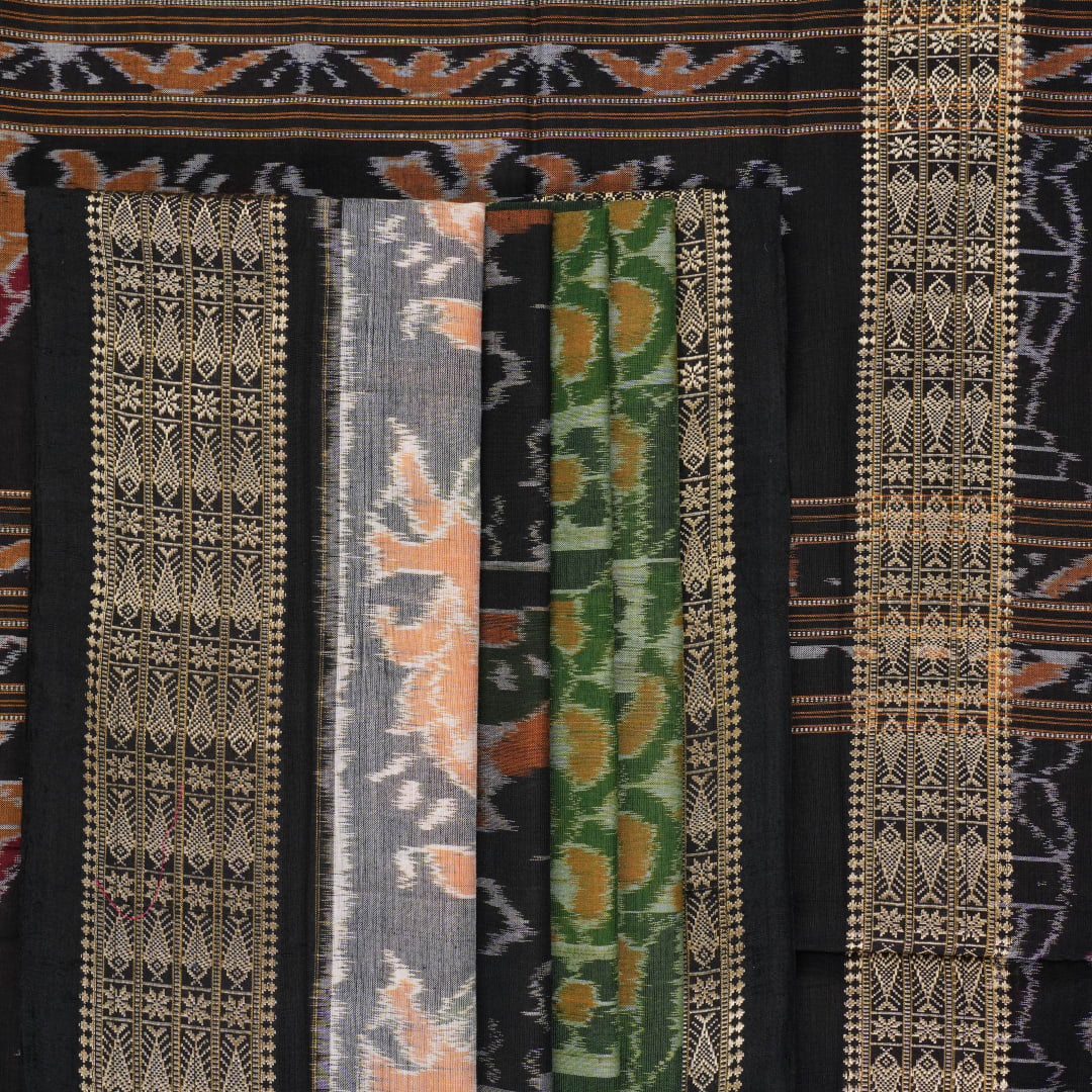 Full layout of green and black Sambalpuri cotton saree showcasing the complete pattern and motifs.