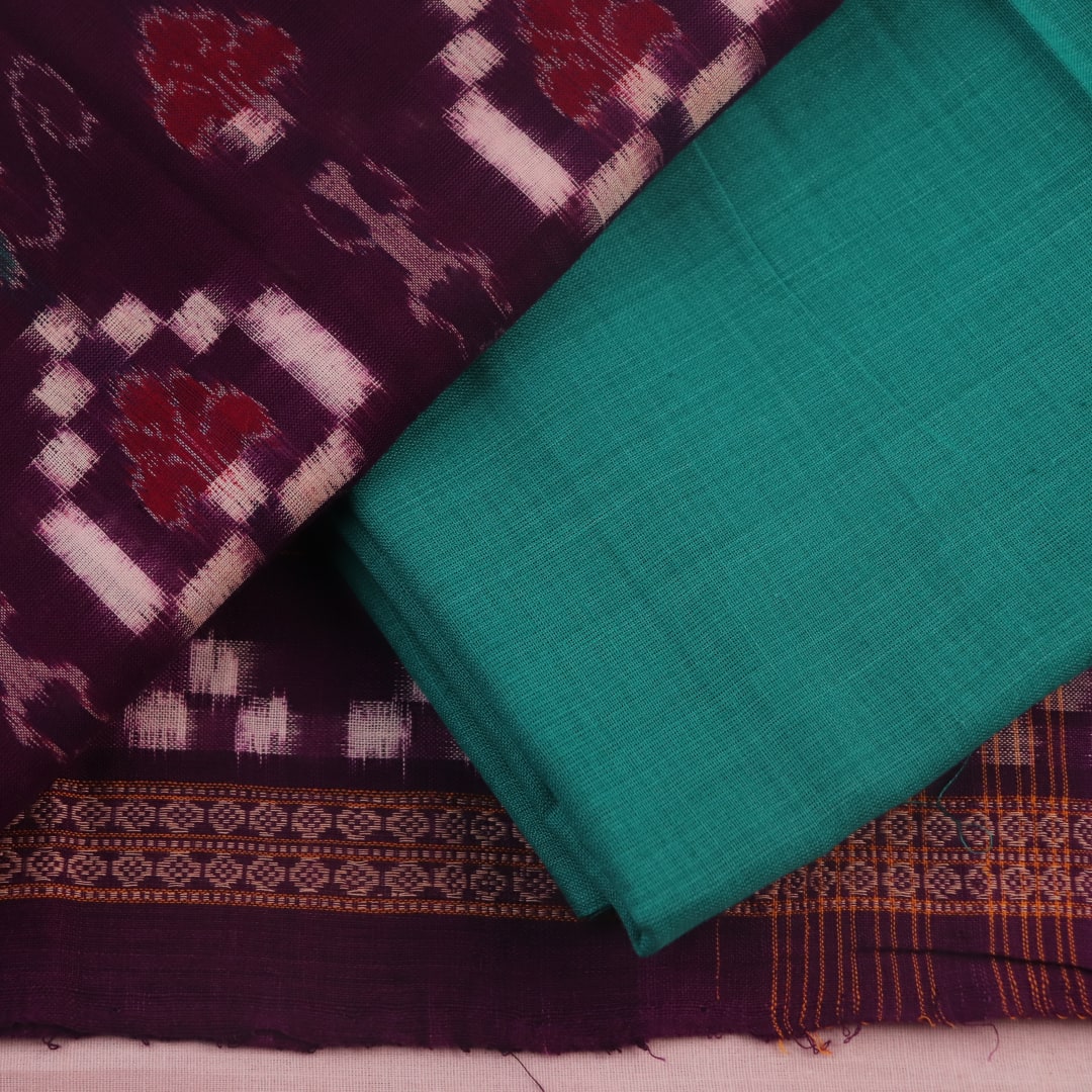 Detail of the purple and green Sambalpuri Pasapalli cotton dress material's blouse piece.