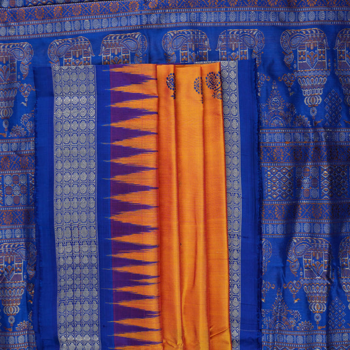 Close-up of Bomkai Silk Saree fabric texture and handloom weave in orange and blue threads.