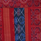 Full flat lay view of a blue and red Sambalpuri cotton saree showcasing the entire body and pallu design.