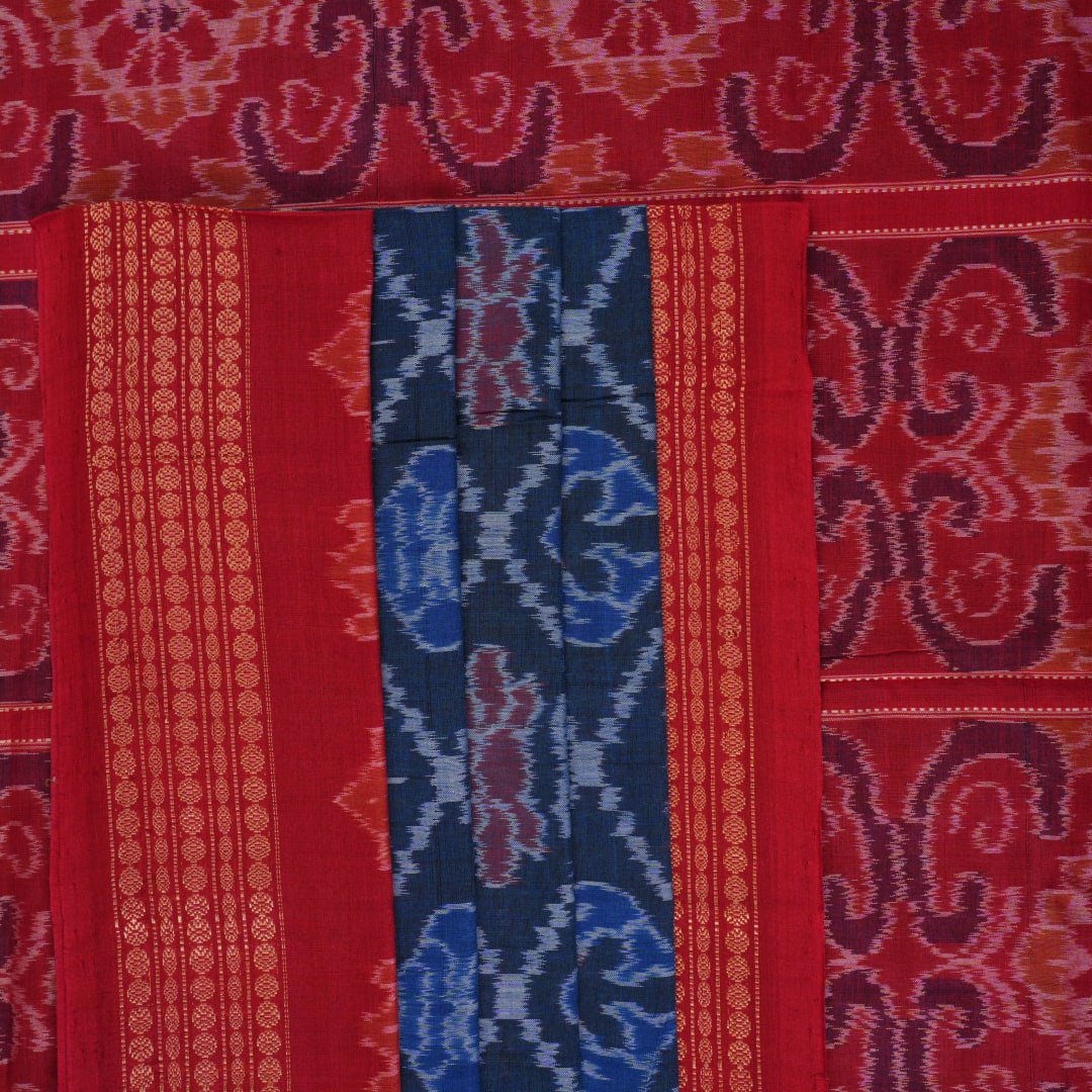 Full flat lay view of a blue and red Sambalpuri cotton saree showcasing the entire body and pallu design.