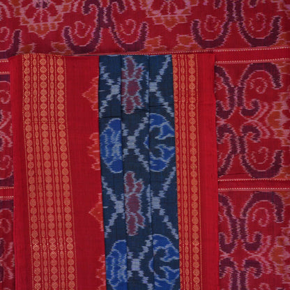 Full flat lay view of a blue and red Sambalpuri cotton saree showcasing the entire body and pallu design.