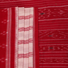 White and red cotton Sambalpuri Saree with motifs, elegantly draped.