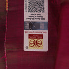 Close-up of magenta Patachitra silk saree fabric texture showing handloom weave and paint details.