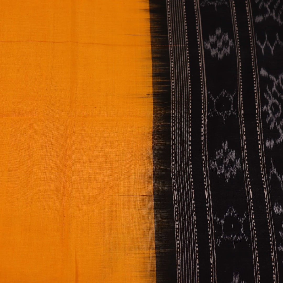 Yellow and black Sambalpuri cotton dupatta draped on a woman