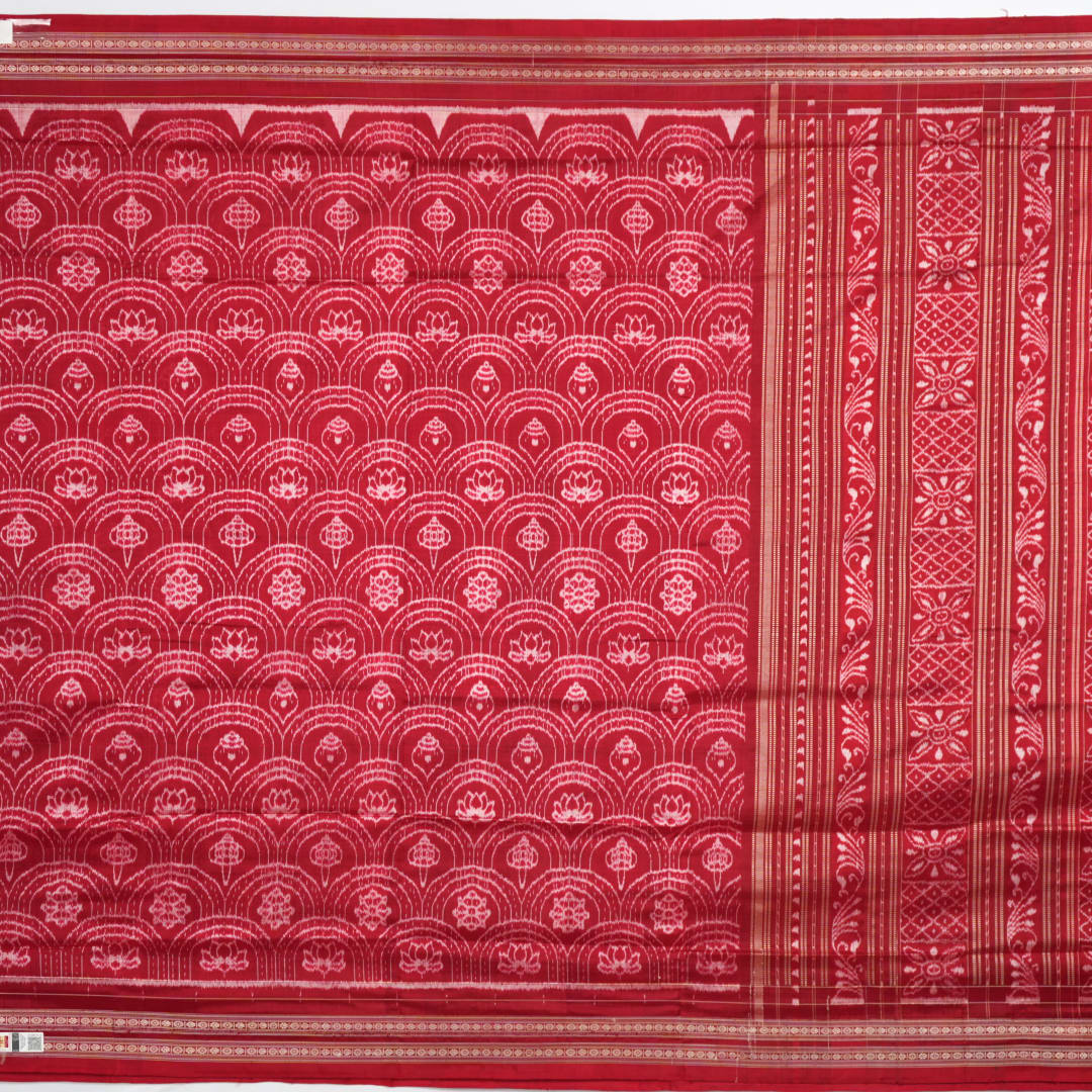 Full view of the maroon Sambalpuri silk saree with traditional motifs, displaying entire length and border.