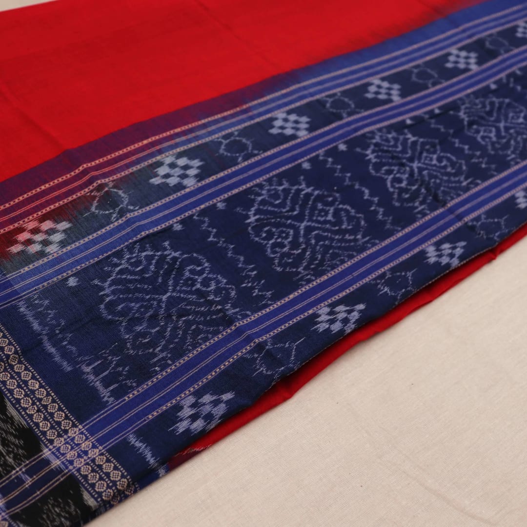 Styling view of a red and blue Sambalpuri cotton dupatta with plain pattern and tassels