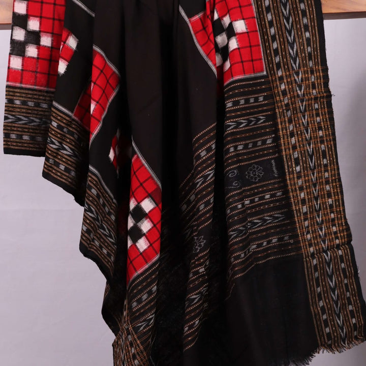 Red and black Sambalpuri cotton dupatta styled draped elegantly