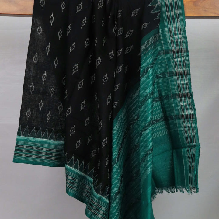 Styling view of a black and green Sambalpuri cotton dupatta with intricate motifs