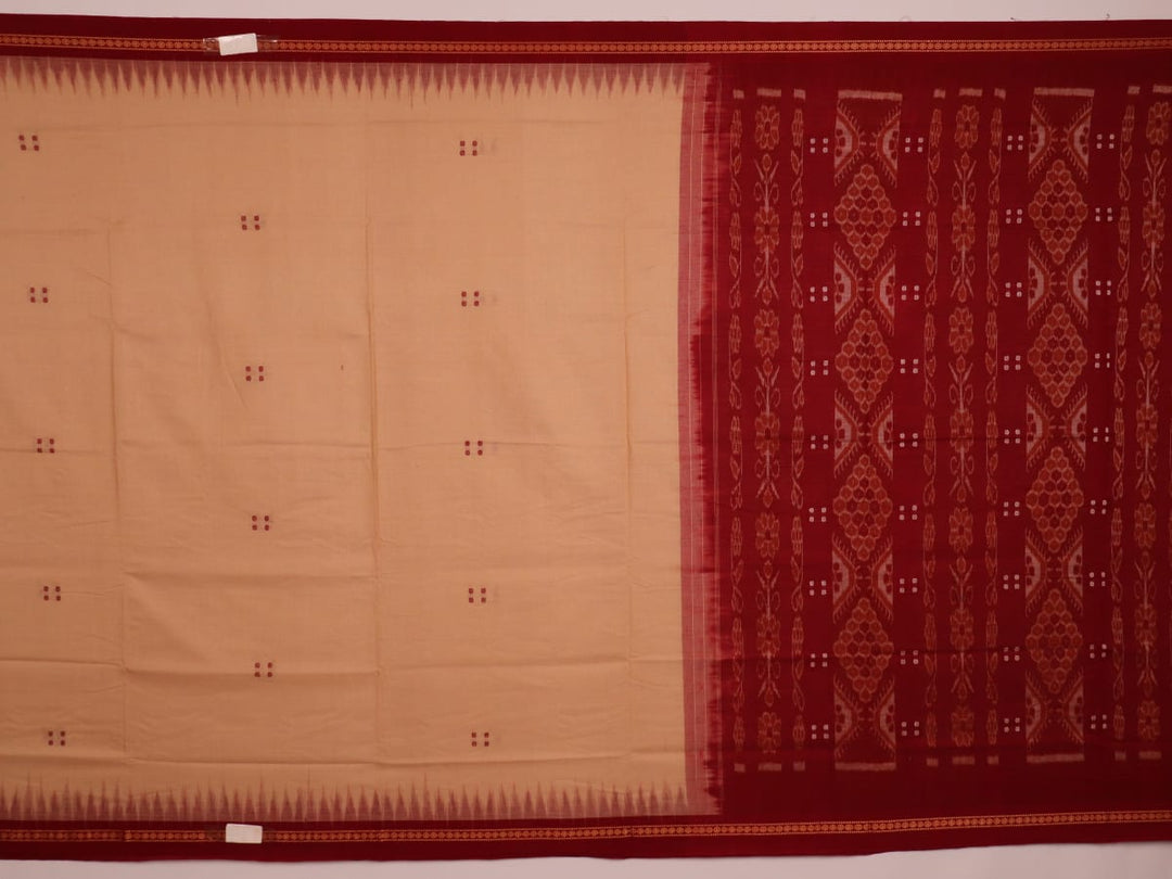 Cream-colored Sambalpuri cotton saree with maroon butta motifs, styled on a model