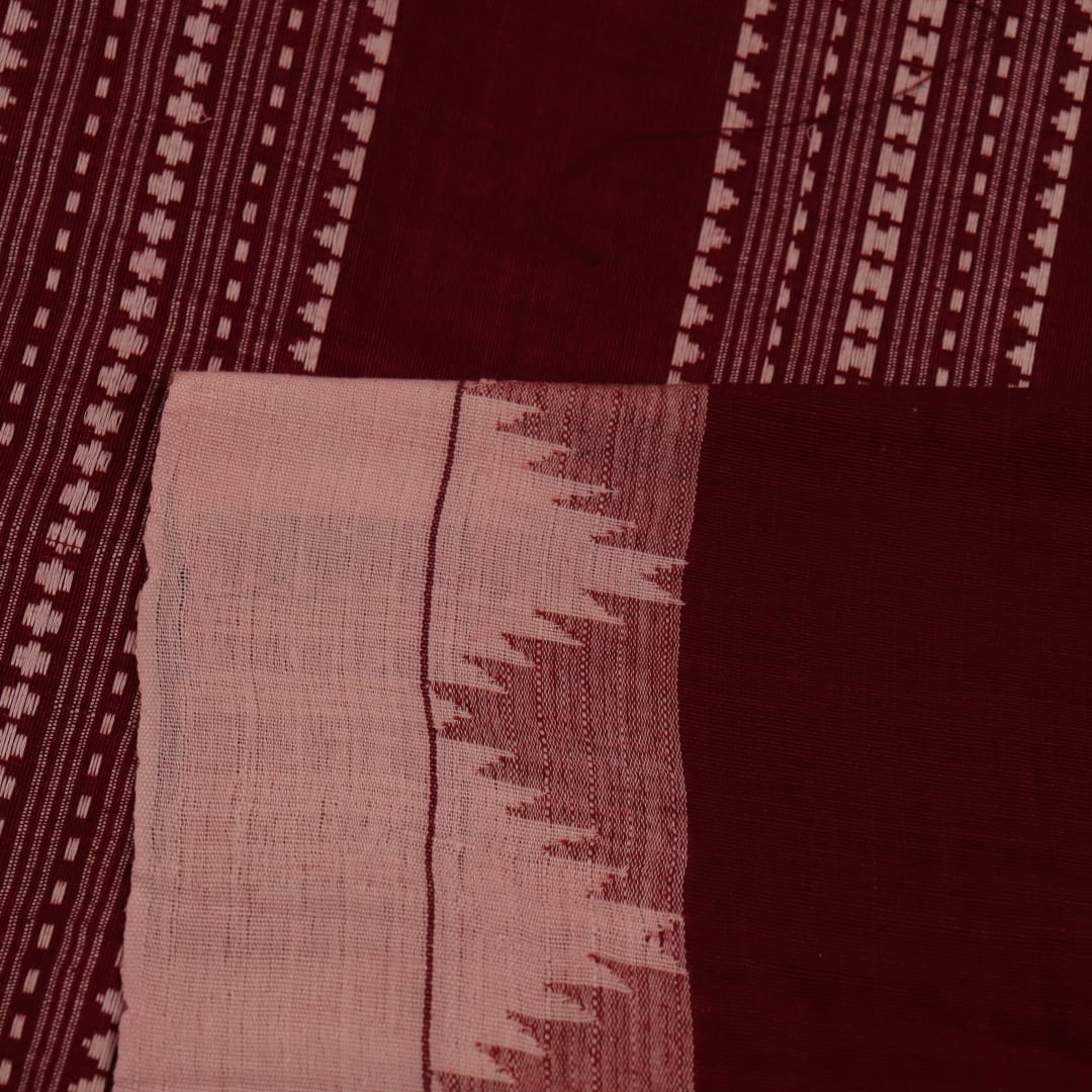 Full view of a maroon and off-white cotton Kotpad saree adorned with a traditional butta pattern.