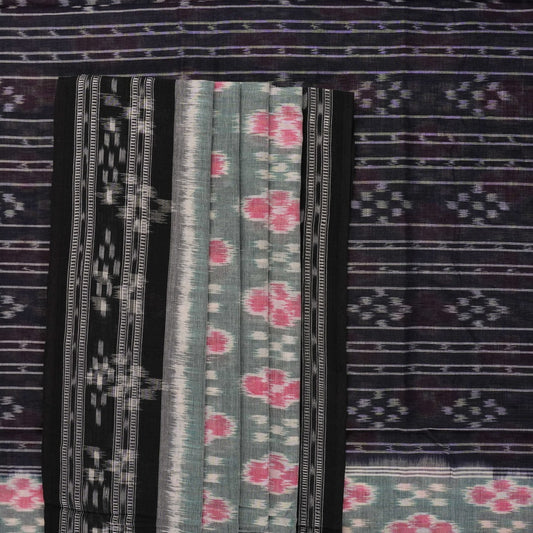 Model wearing a green and black Sambalpuri cotton saree showcasing traditional handloom drape and motifs.