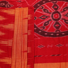Draped plain yellow Sambalpuri cotton saree with red border.