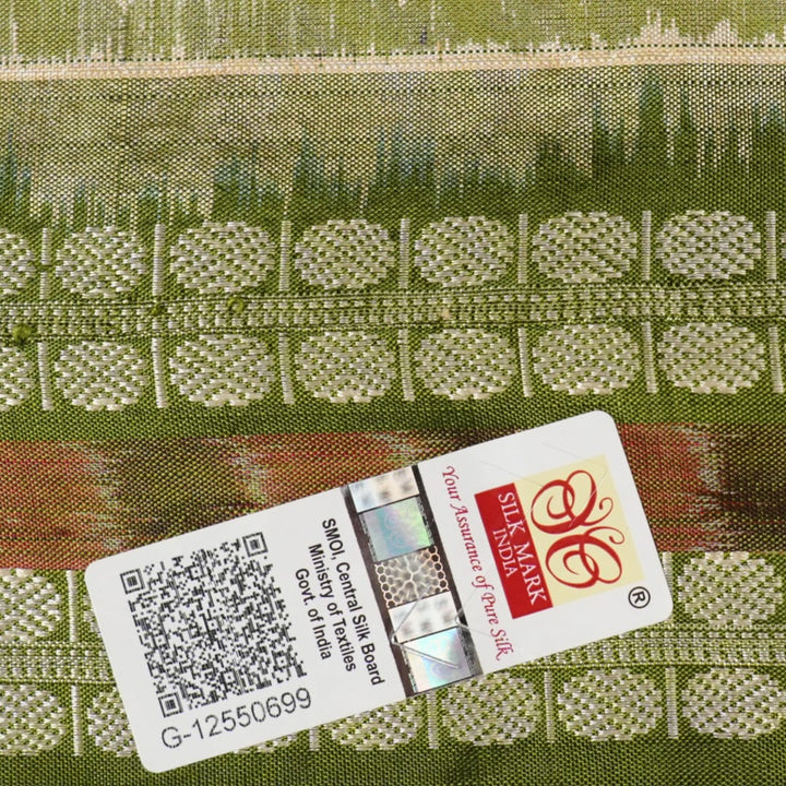 Extreme close-up of cream Sambalpuri silk saree showing exquisite handloom weave texture.