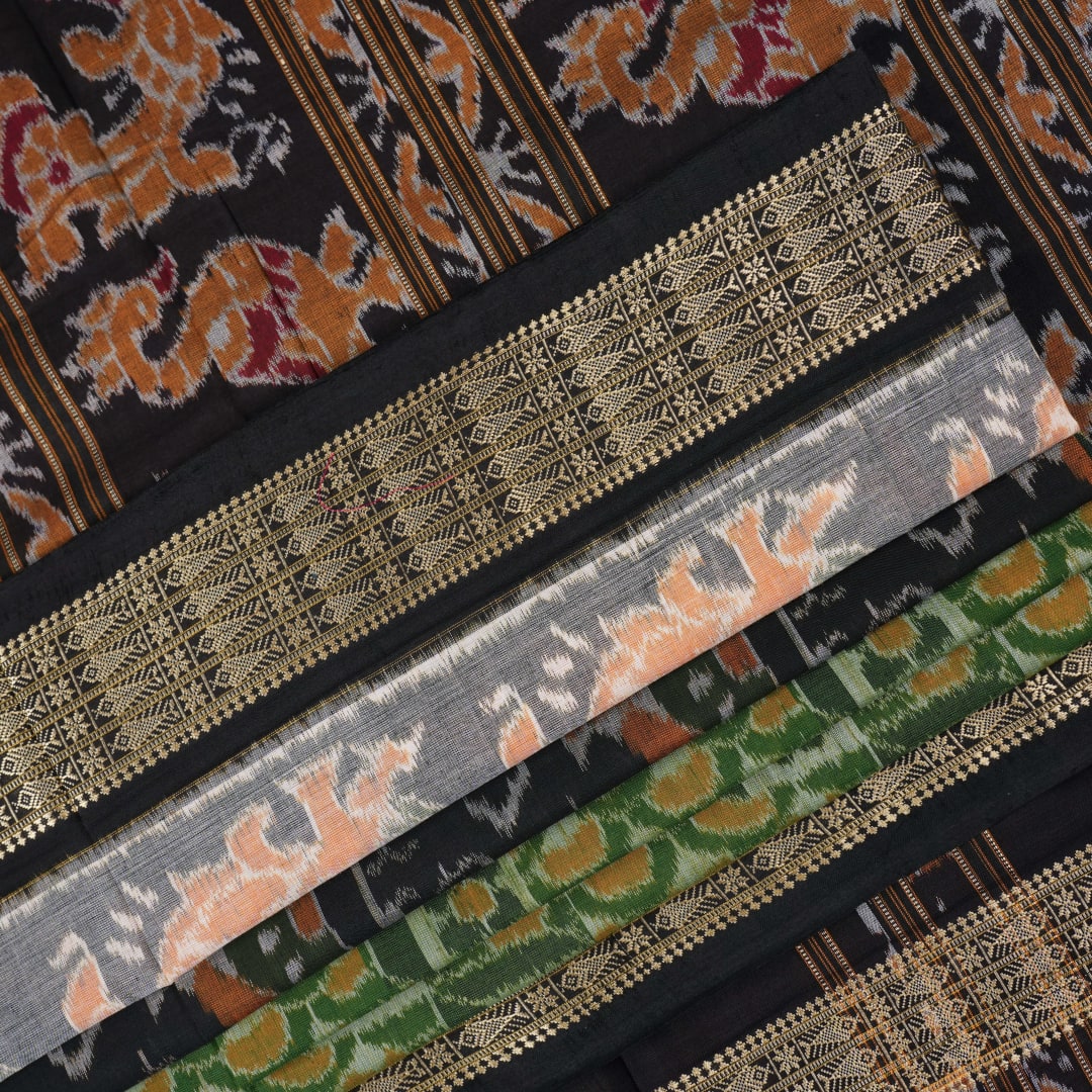 Full layout of green and black Sambalpuri cotton saree showcasing the complete pattern and motifs.