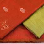 Detail of rust and green Bomkai silk blouse piece with butta pattern.