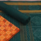 Blouse piece detail of the rust and green Sambalpuri cotton dress material with motifs.