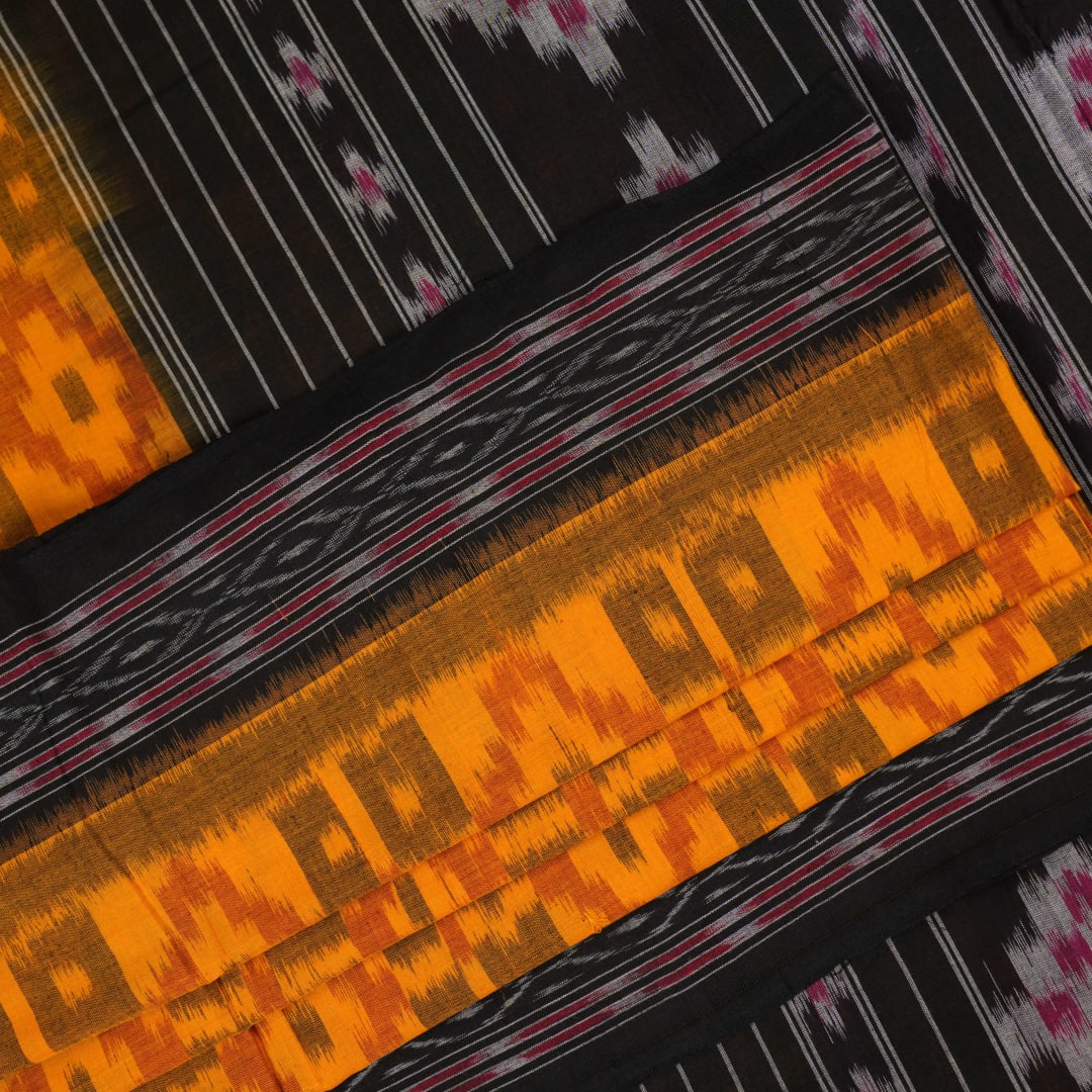 Professional styling of the yellow and black Sambalpuri cotton saree with traditional motifs shown on a model.