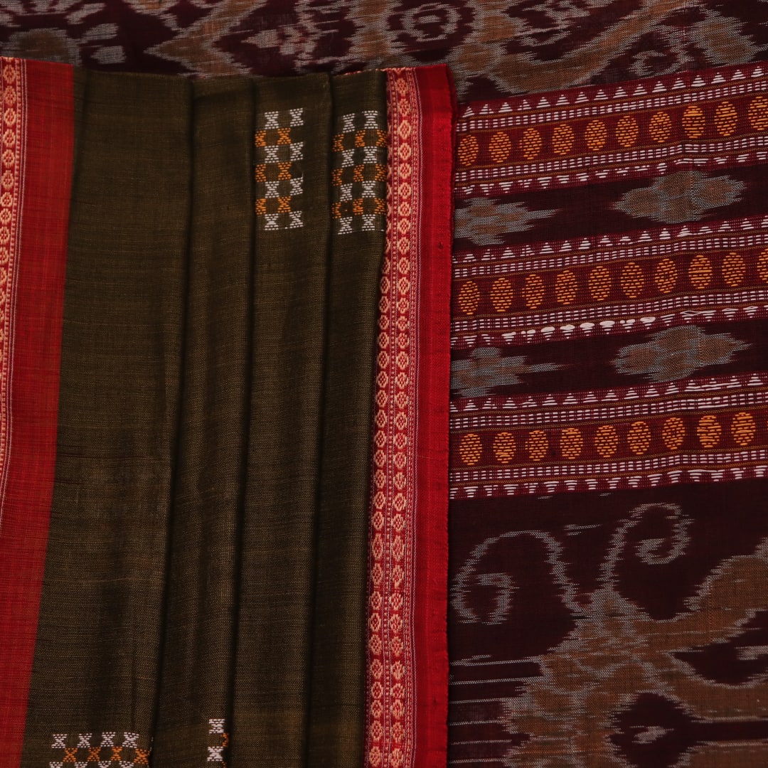 Full view of a green and red Bomkai cotton handloom saree with a butta pattern.