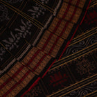 Full view of a black and black cotton Sambalpuri saree with intricate motif patterns.