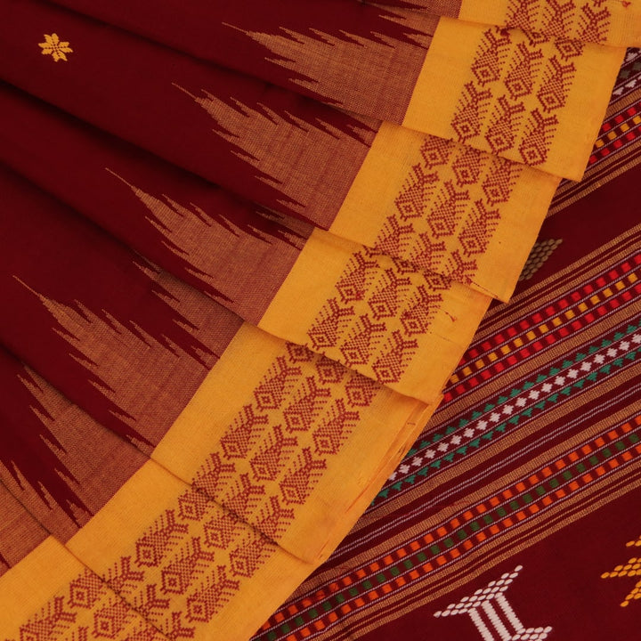 Full view of a maroon and yellow cotton Berhampuri saree with butta pattern.