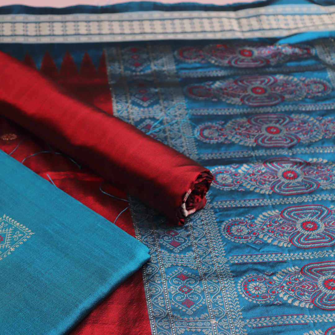 Detail of blue Bomkai silk dress material blouse piece with maroon butta.