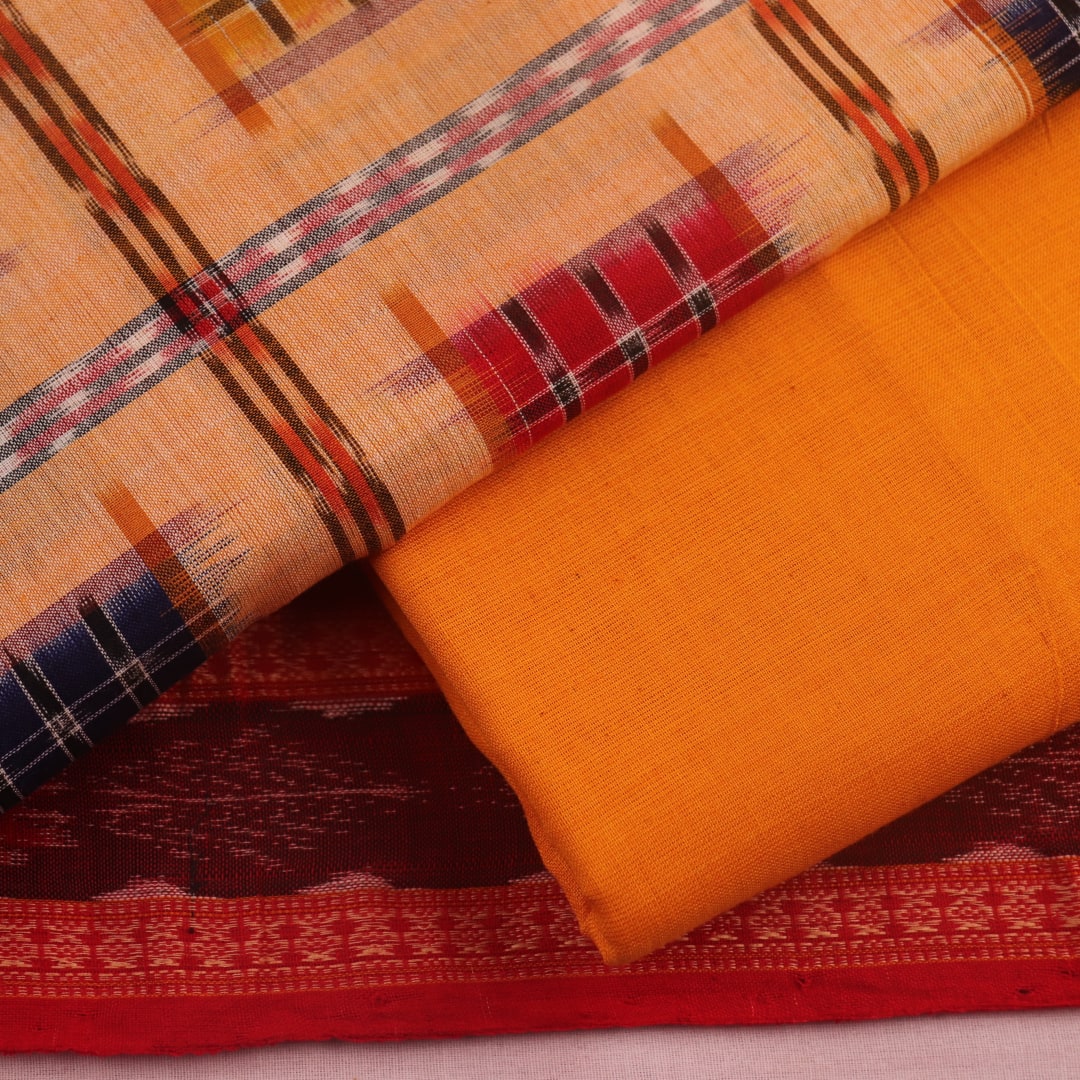 Detail of cream and yellow motif Sambalpuri cotton blouse piece.