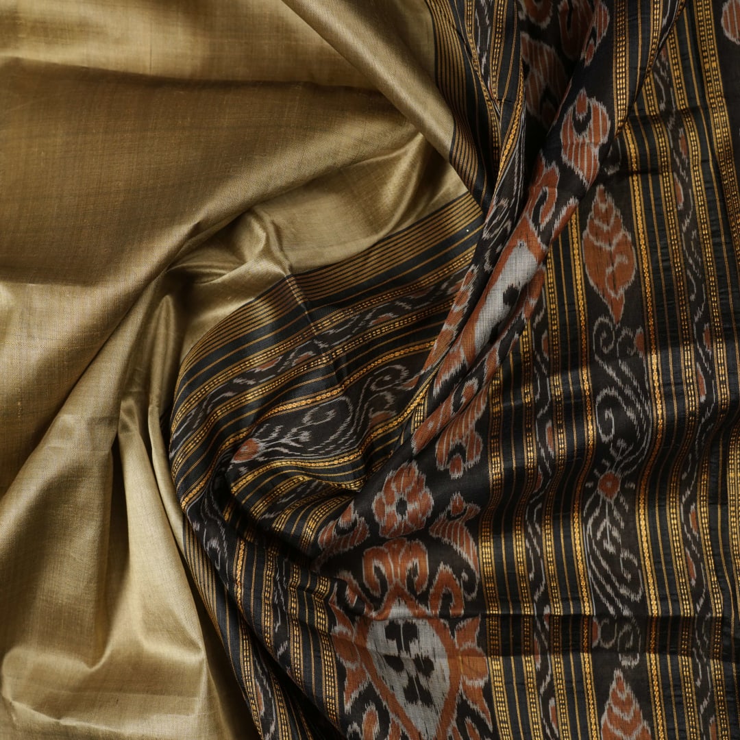 Full styling view of a model draped in a brown and black Khandua silk saree from Odisha