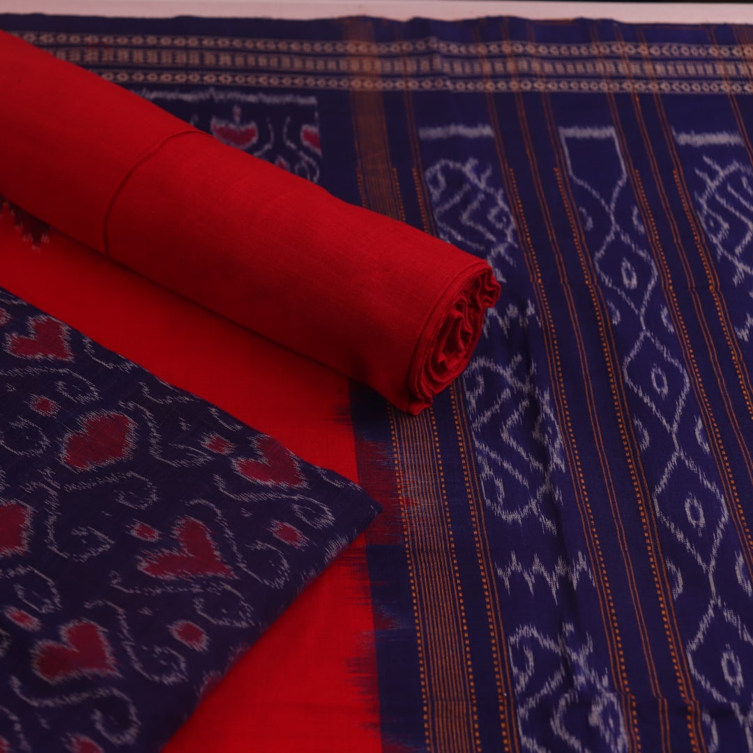 Blouse piece detail of blue & red Sambalpuri cotton dress material with motifs.