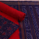 Blouse piece detail of blue & red Sambalpuri cotton dress material with motifs.