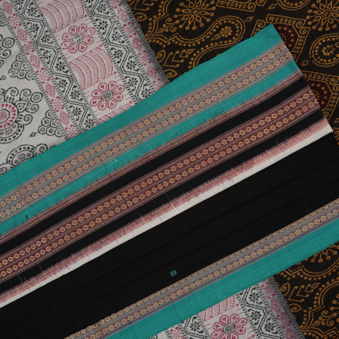 Full view of the black and green Bomkai cotton handloom saree showing the complete body, pallu, and border.