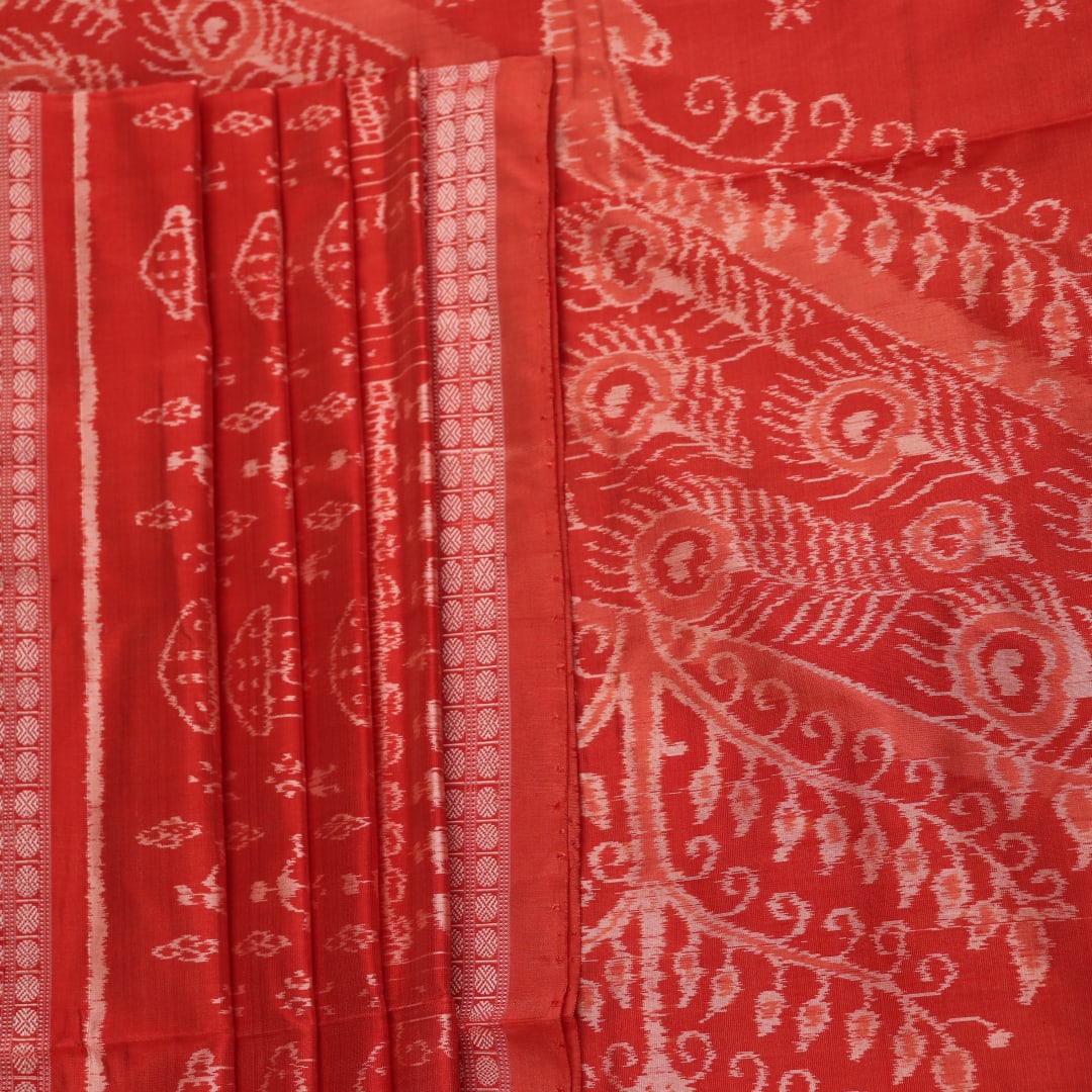 Close-up showcasing the intricately woven silk fabric texture of a multi-colored Sambalpuri saree with traditional motifs.