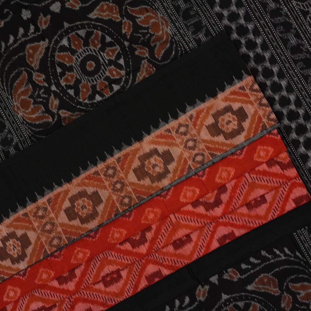Full layout of the orange and black Sambalpuri cotton saree displaying the complete pattern and design.
