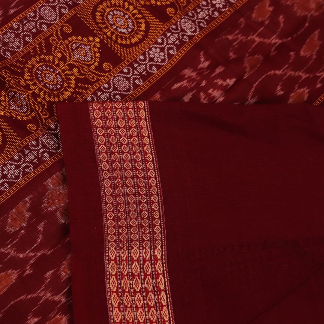 Full view of a cream cotton Bomkai saree with a maroon butta pattern.