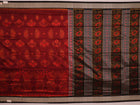 Close-up of intricate motifs on a maroon Sambalpuri silk saree