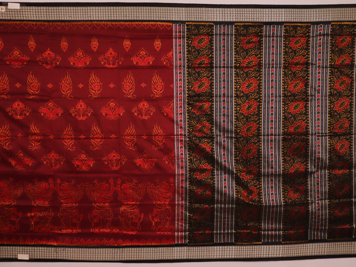 Close-up of intricate motifs on a maroon Sambalpuri silk saree