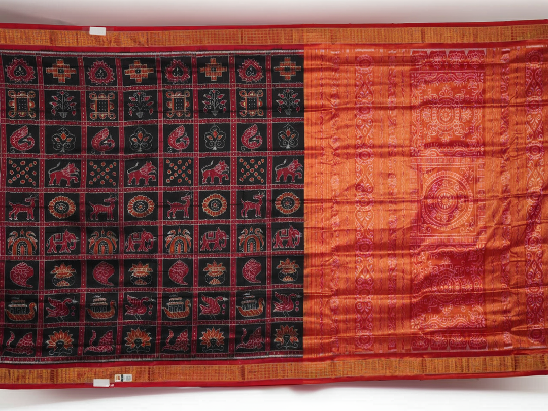 Close-up of Sambalpuri silk saree fabric, revealing rich texture, weave, and subtle tissue motifs.