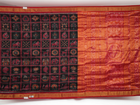 Close-up of Sambalpuri silk saree fabric, revealing rich texture, weave, and subtle tissue motifs.