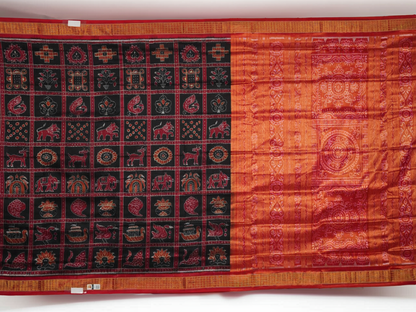 Close-up of Sambalpuri silk saree fabric, revealing rich texture, weave, and subtle tissue motifs.