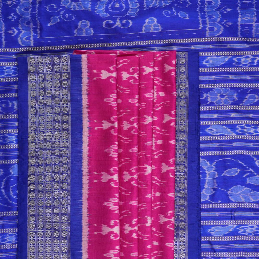 Close-up showing the luxurious handloom silk fabric texture and fine weave of the pink Sambalpuri saree.