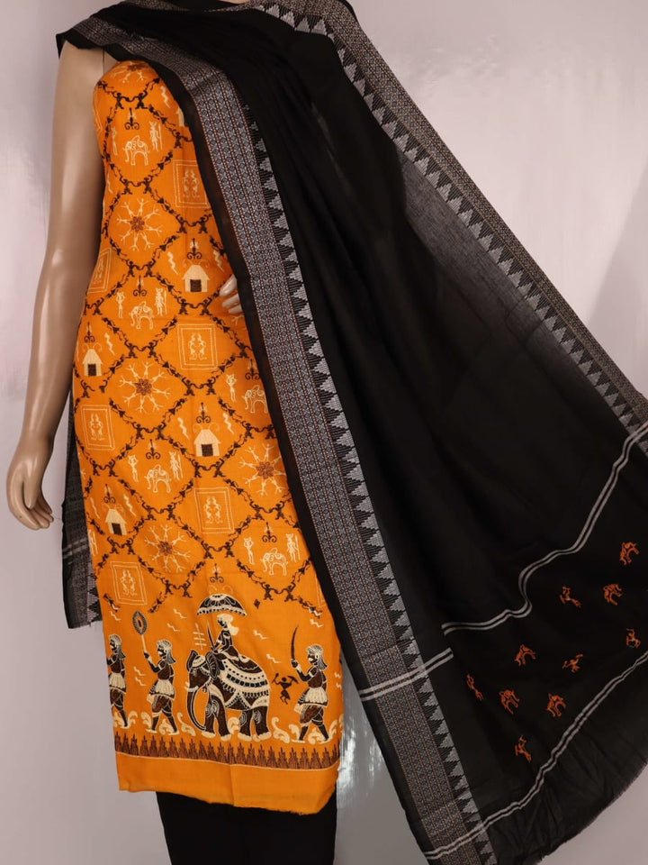 Close-up of blouse piece design featuring a doll pattern in yellow and black cotton Sambalpuri dress material